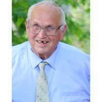 Smiling elderly man in glasses outdoors