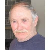 Elderly man with gray hair and mustache