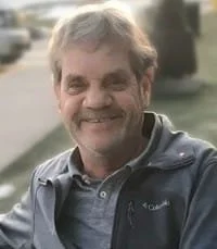 Smiling man in outdoor setting