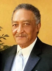 Man in suit smiling at camera
