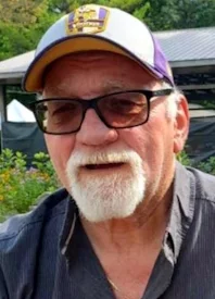 Man with beard and glasses wearing a cap