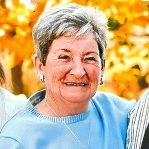 Smiling woman with autumn leaves background