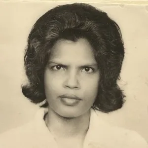 Vintage portrait of a woman with styled hair.