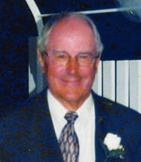 Man in suit smiling at event