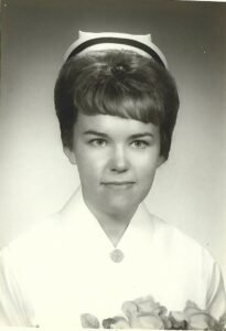 Vintage photo of a nurse with a cap.